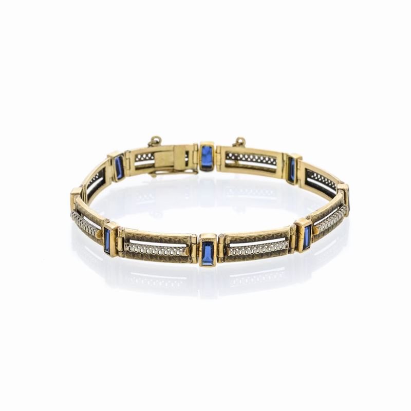 Braccialetto in oro giallo, oro bianco e pietre blu