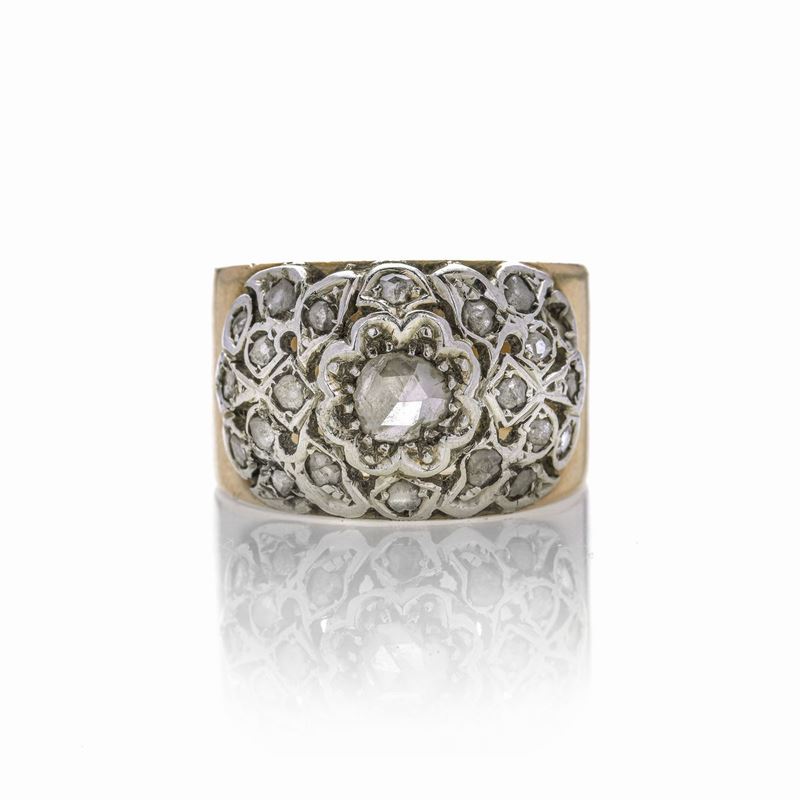 Anello a fascia in oro giallo, oro bianco e diamanti