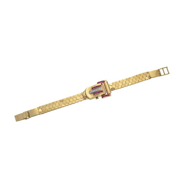 Watch bracelet in yellow gold, diamonds and red stones