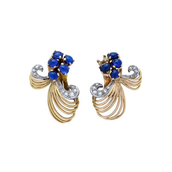 Pair of clip earrings in yellow gold, white gold, diamonds and sapphires