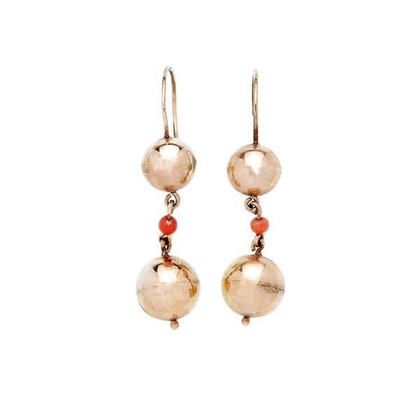 Pair of 14 kt gold and coral dangle earrings
