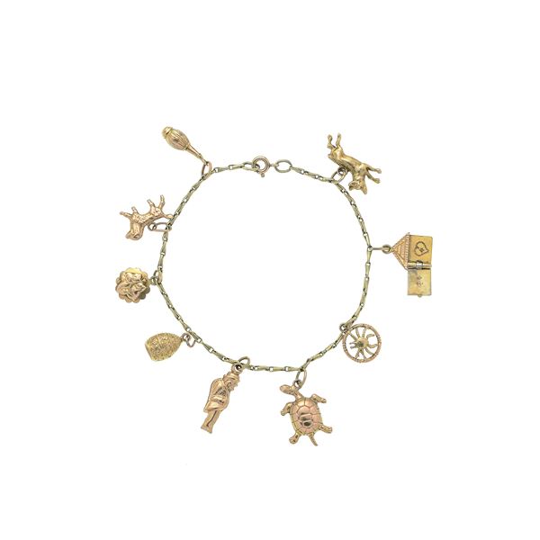 Bracelet with charms in yellow gold