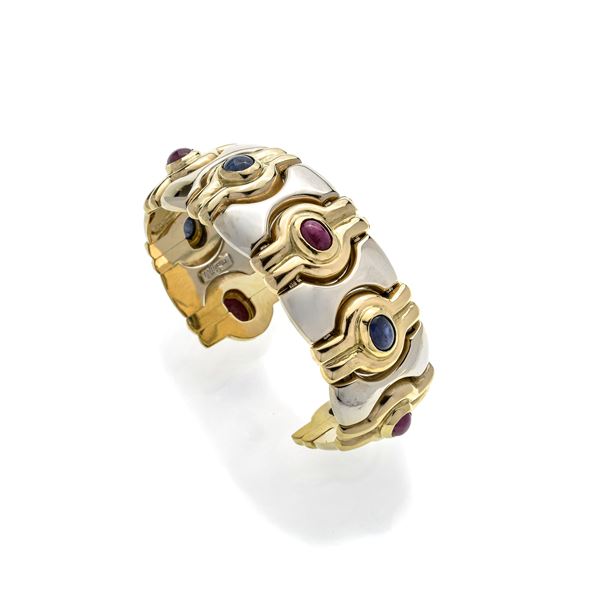 Large rigid bracelet in yellow gold, white gold, sapphire and rubies