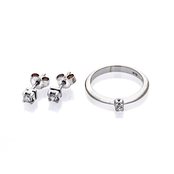 Pair of earrings and ring in white gold and diamonds