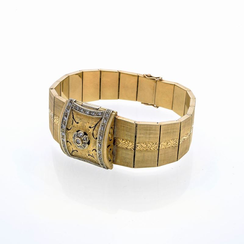 Bracciale orologio in oro giallo, oro bianco e diamanti
