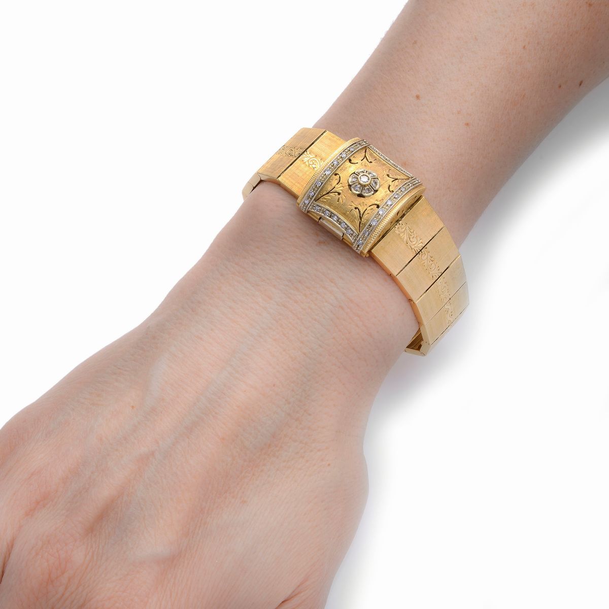Bracciale orologio in oro giallo, oro bianco e diamanti