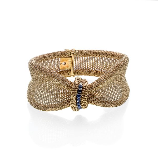 Bow bracelet in yellow gold and sapphires