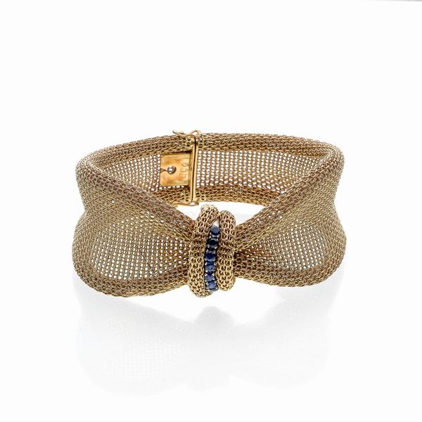 Bow bracelet in yellow gold and sapphires