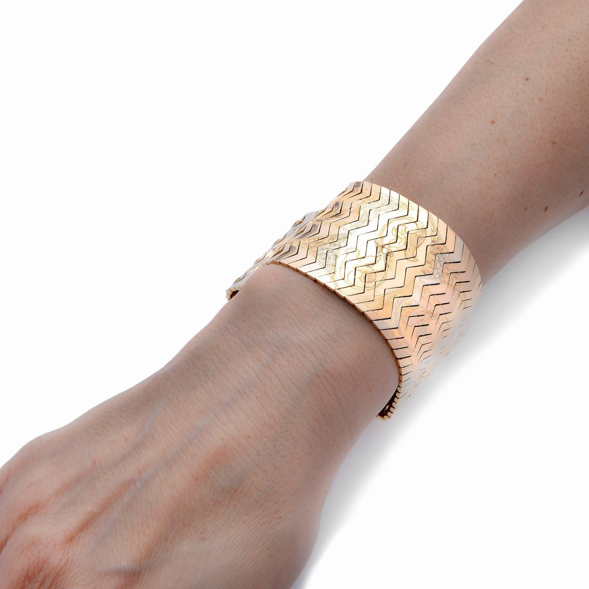 Alto bracciale in oro giallo e oro bianco