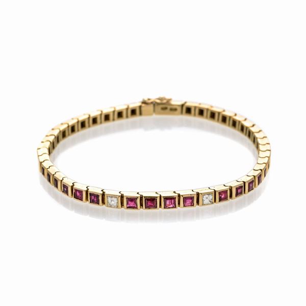 Bracciale tennis in oro giallo, rubini e diamanti