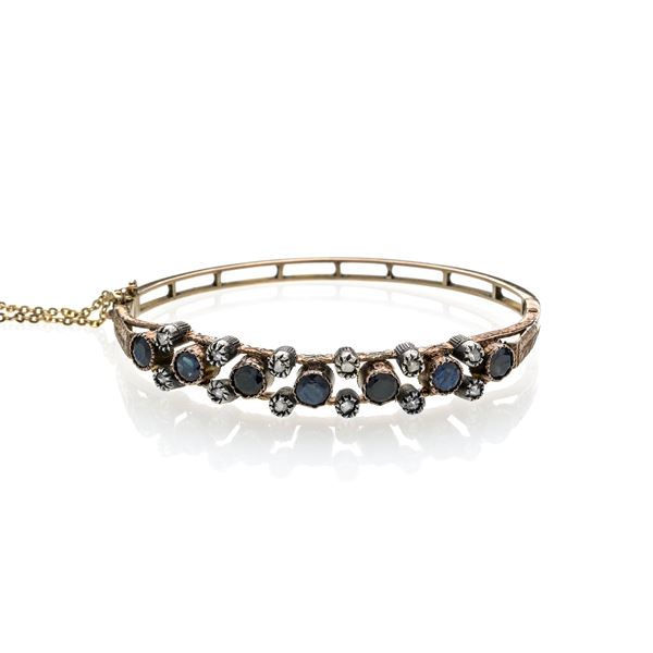 Bangle in 14k rose gold, silver, diamonds and sapphires
