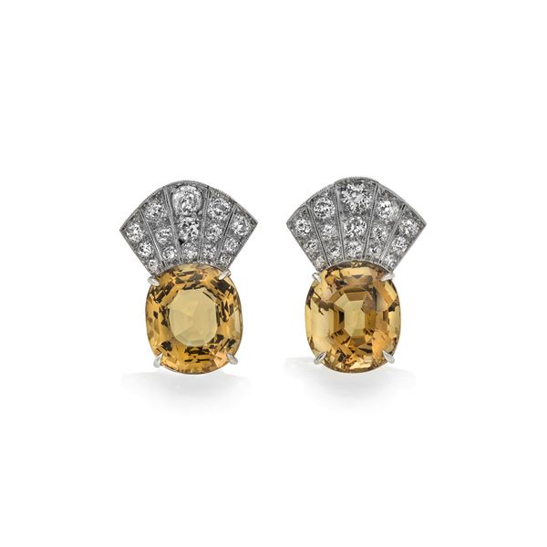 Pair of earrings in platinum, diamonds and natural orange beryl