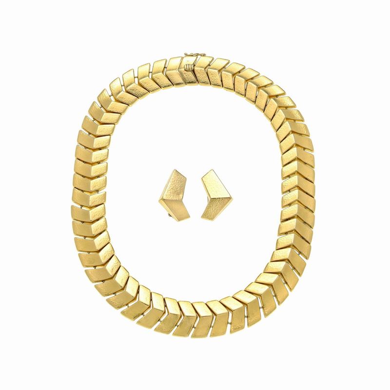 Paio di orecchini a clips e girocollo in oro giallo 18 kt