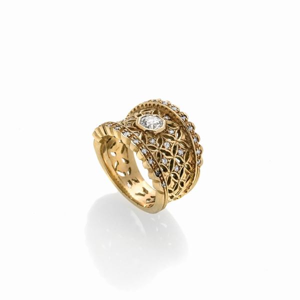 Anello a fascia in oro giallo 18 kt e diamanti