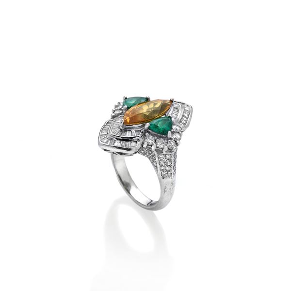 Lozenge ring in 18 kt white gold, diamonds, emeralds and orange quartz