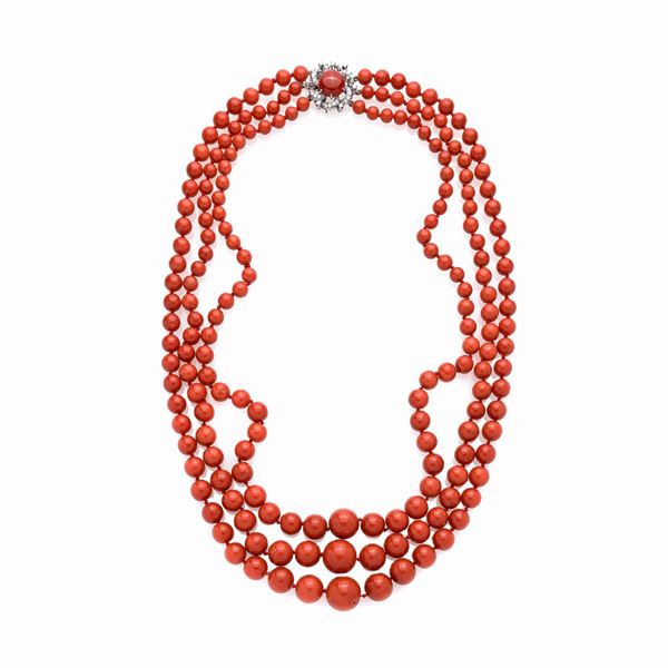 Long three-strand necklace in red coral, 18 kt white gold and diamonds