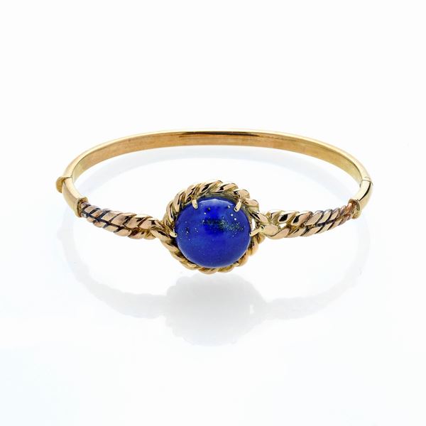 Rigid bracelet in 18 kt yellow gold and lapis lazuli