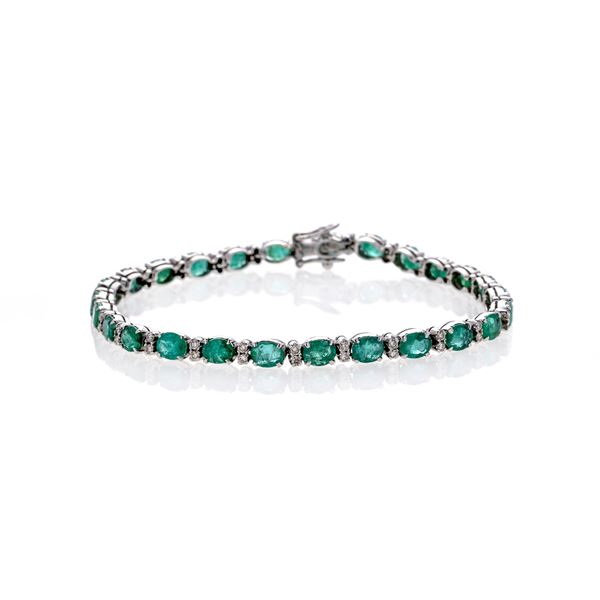 Tennis bracelet in white gold, diamonds and emeralds