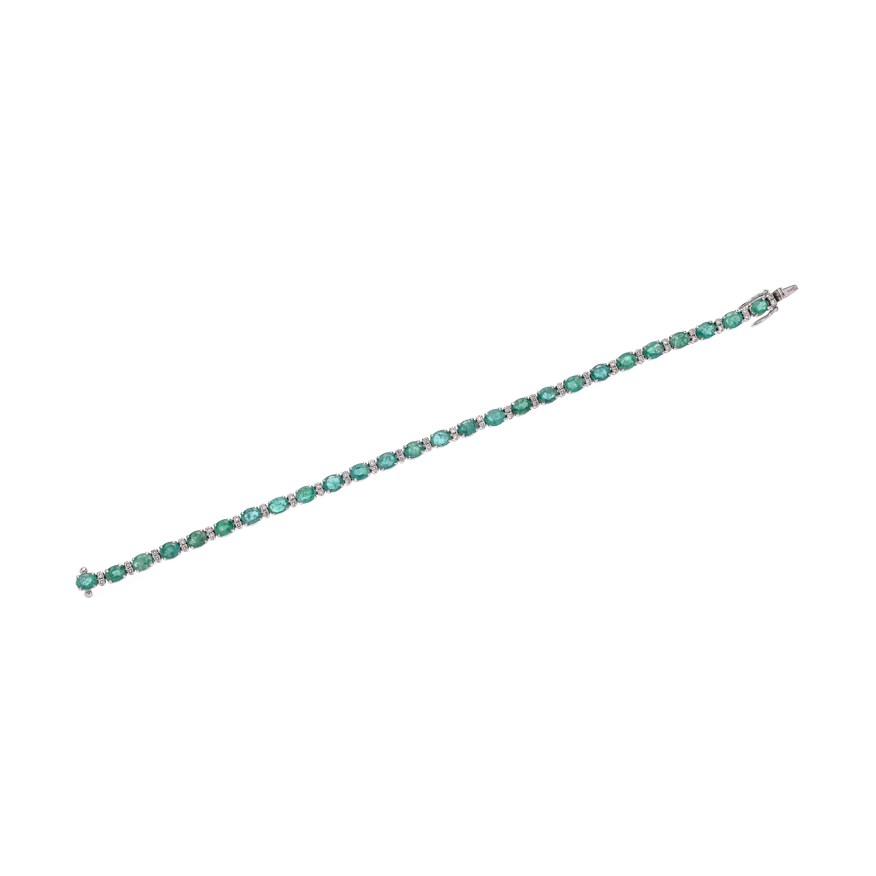 Bracciale tennis in oro bianco, diamanti e smeraldi