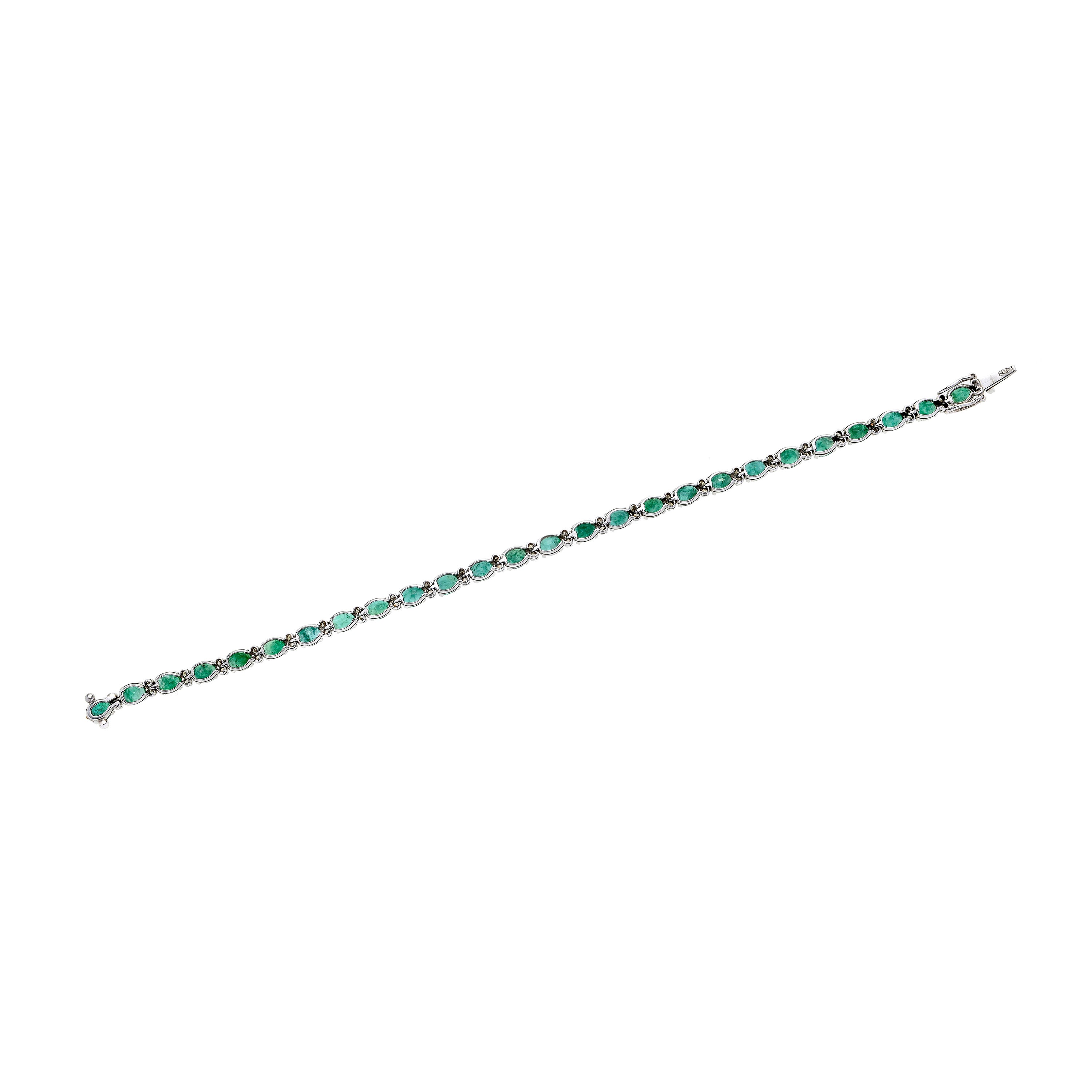 Bracciale tennis in oro bianco, diamanti e smeraldi