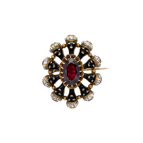 "Moretti" oval pendant brooch in yellow gold, garnet and enamels in shades of black and white
