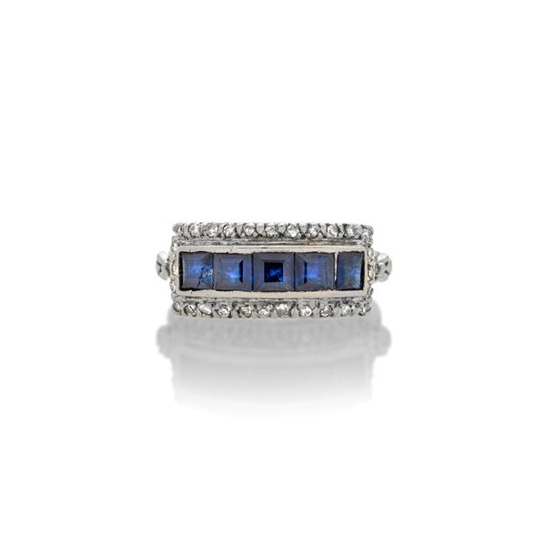 Bridge ring in white gold, diamonds and sapphires
