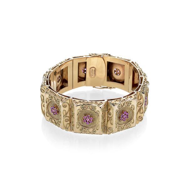 Alto bracciale in oro giallo e rubini