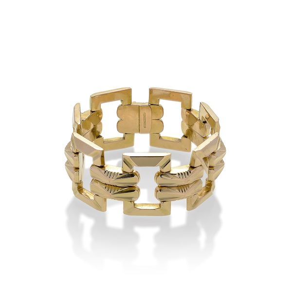 Alto bracciale di ispirazione geometrica in oro giallo 
