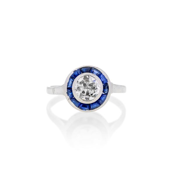 Solitaire ring in platinum, sapphires and diamond