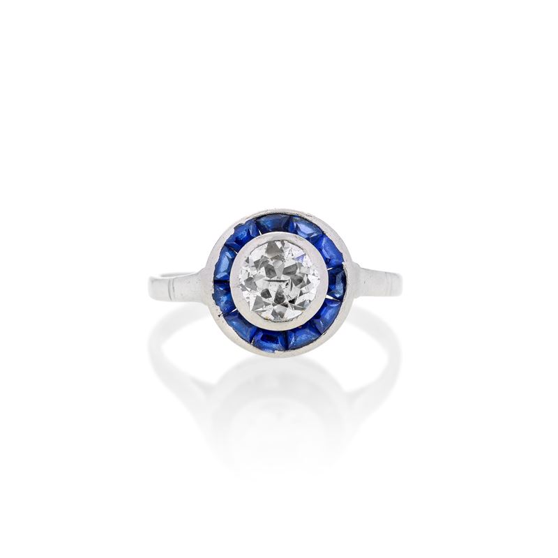 Anello solitario in platino, zaffiri e diamante