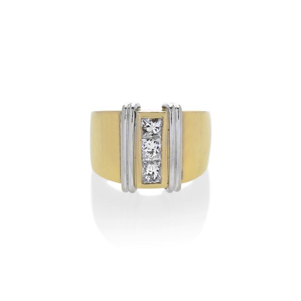 Band ring in yellow gold, white gold and three diamonds