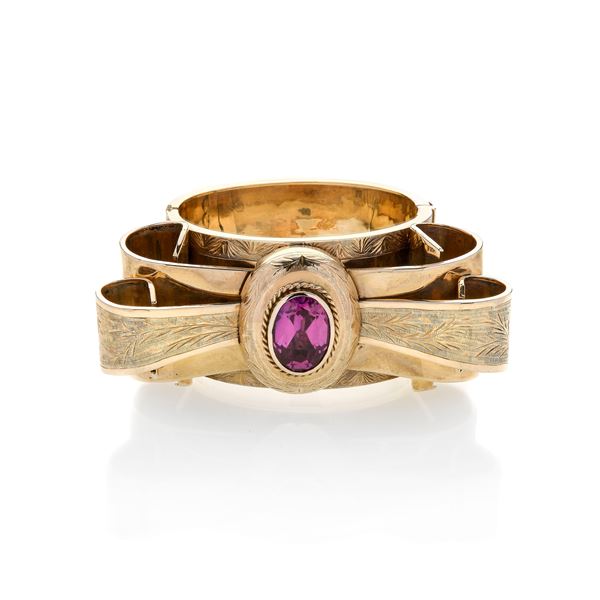 Large Fiocco rigid bracelet in 12 kt gold and purple stone