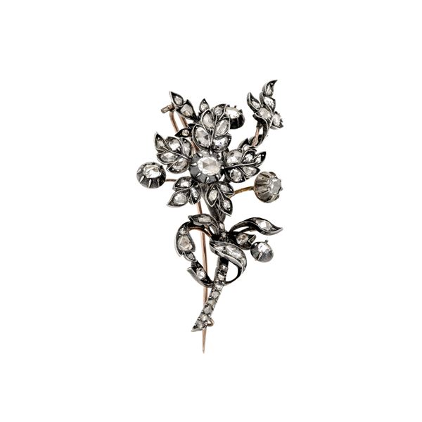 Flower brooch in low title gold, silver and diamonds