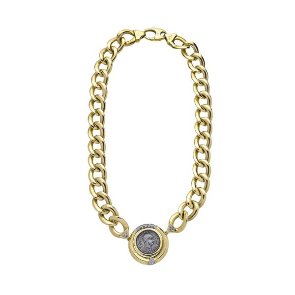 Necklace in yellow gold with silver coin and diamonds