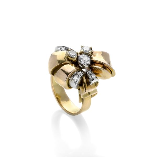 Large bow ring in yellow gold and diamonds