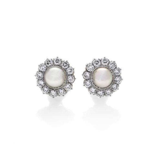 Pair of daisy earrings in white gold, diamonds and cultured pearls