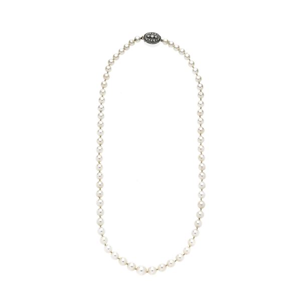 String of cultured pearls, low gold, silver and diamonds