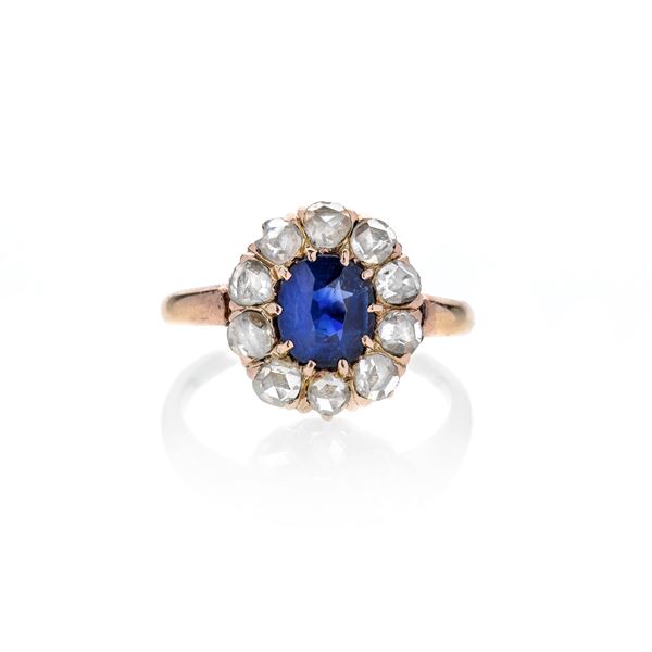 Daisy ring in yellow gold, diamonds and oval sapphire