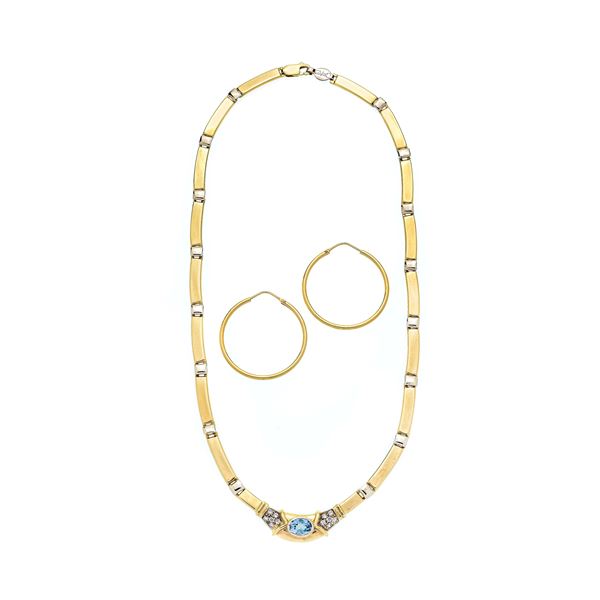 Semi-rigid necklace in yellow gold and aquamarine and hoop earrings