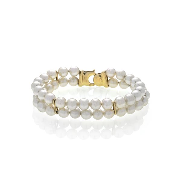 Bracelet in yellow gold and cultured pearls