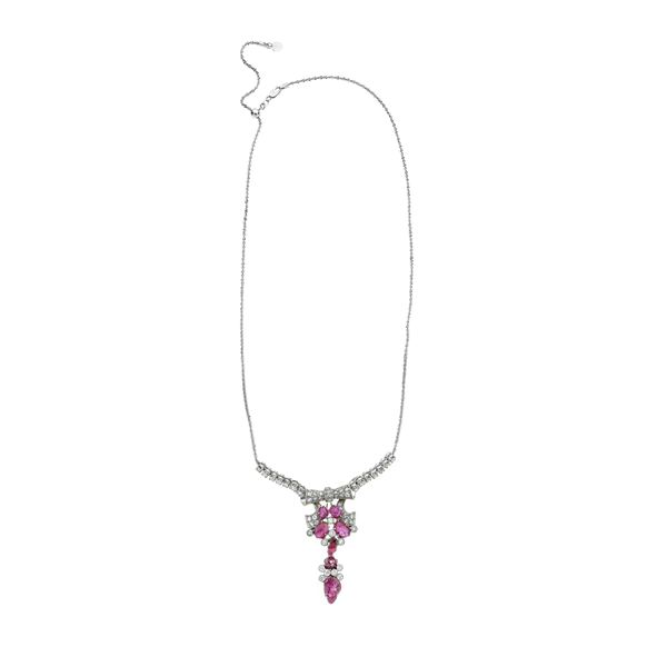 Necklace with pendant in white gold, diamonds and carved rubies