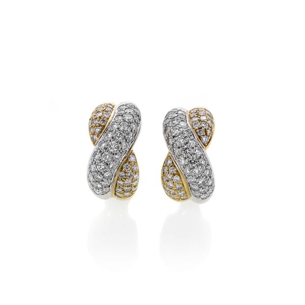 Pair of knot earrings in white gold, yellow gold and diamonds