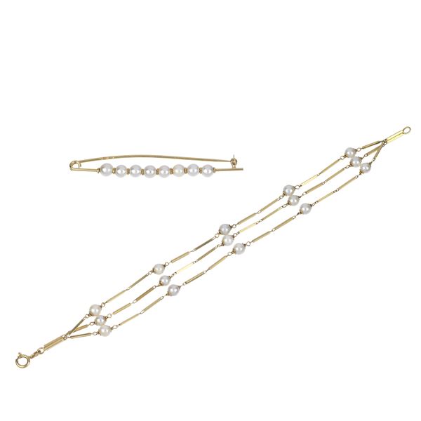 Bracelet and safety pin in 18 kt yellow gold and cultured pearls