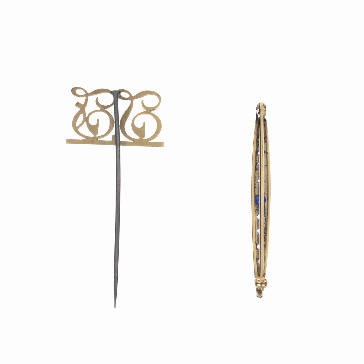 Lotto di una spilla a barretta ed un fermacravatta in oro giallo 18 kt e metallo