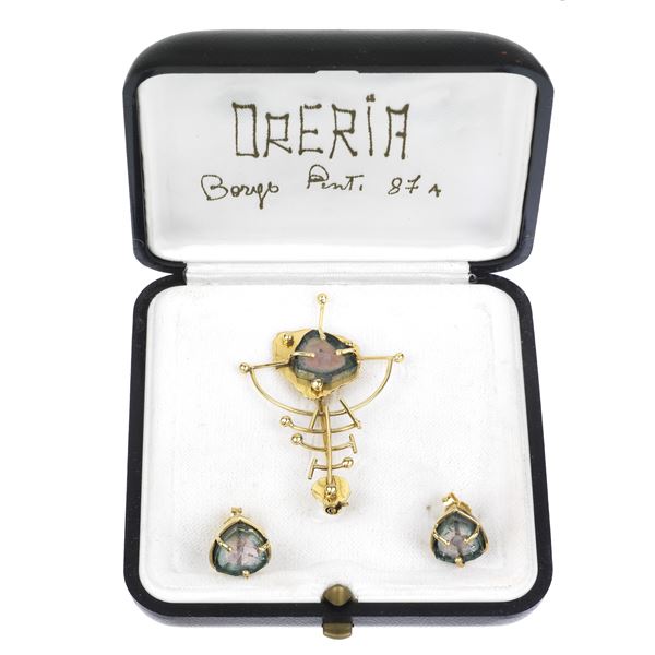 Set in 18 kt yellow gold and water melon tourmaline consisting of a pair of earrings and a pendant