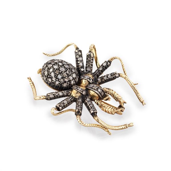 Spider brooch in 9 kt gold, 800 silver and diamond roses