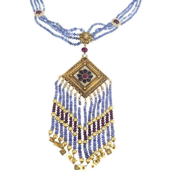 Necklace with long pendant in 18 kt yellow gold, diamonds, sapphires and rubies