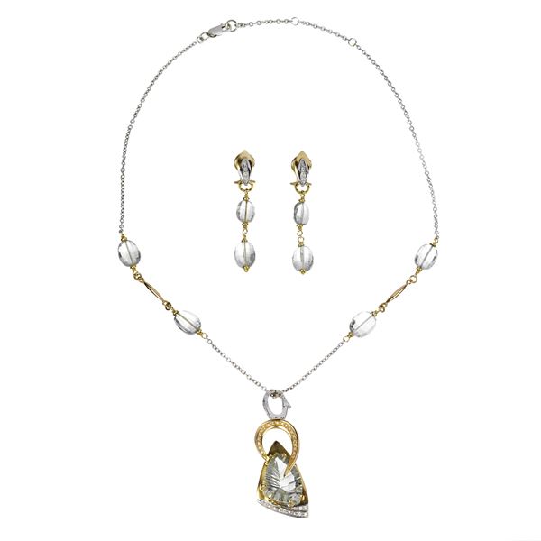 Parure in oro bianco e oro giallo 18 kt, diamanti e acquamarina