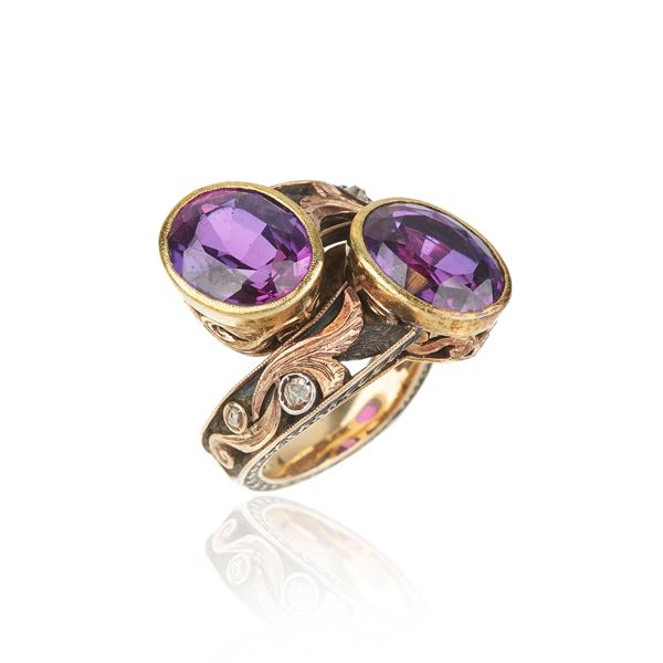 Large contrary ring in yellow gold, silver, diamonds and two purple synthetic corundums