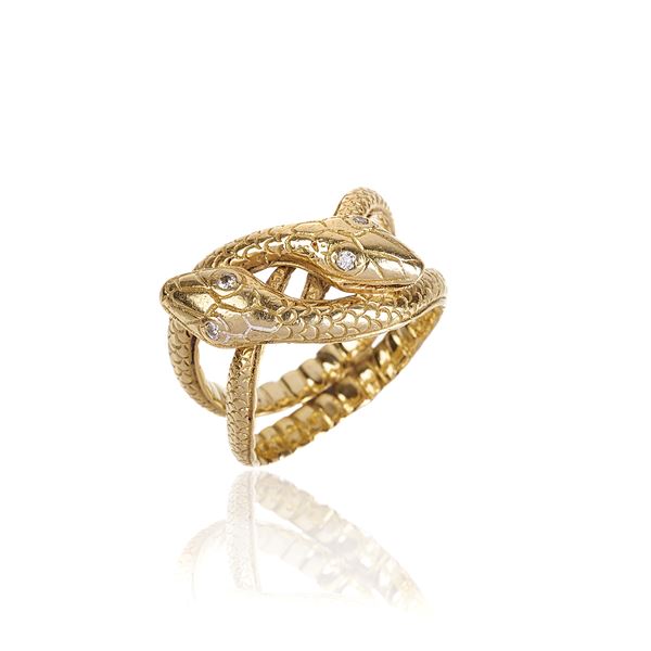 Ring with intertwined snakes in yellow gold and diamonds